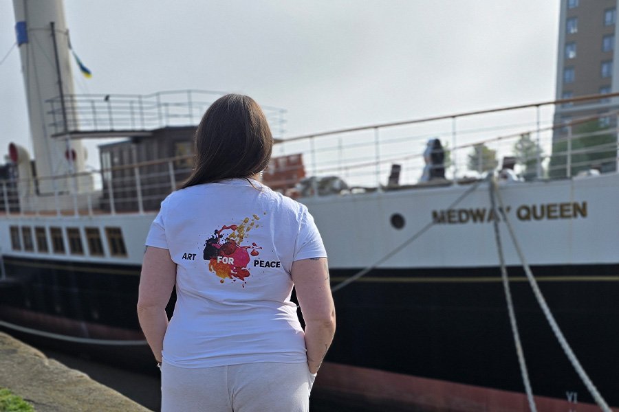 Aliya Bodnar walking on the deck of the Medway Queen before the charity art auction “Art for Peace”.