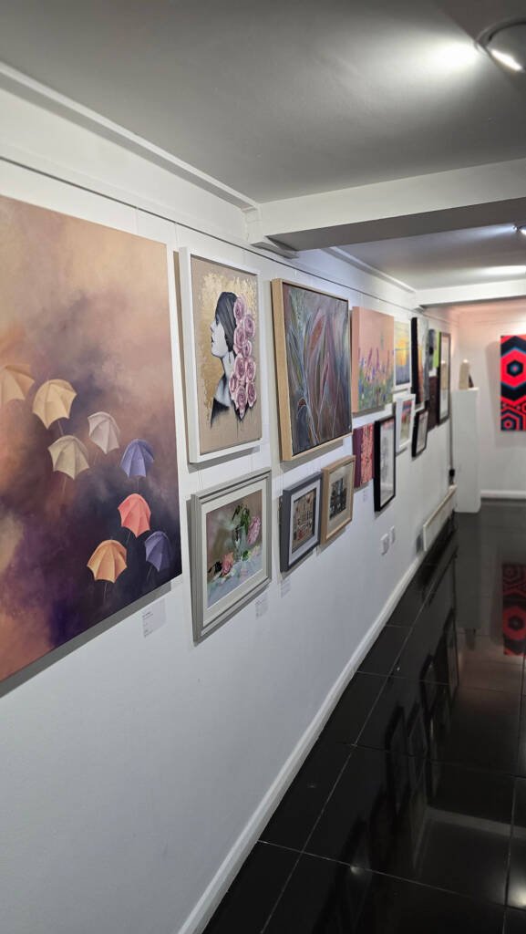 Watercolour artworks, including “Sanctuary in Motion” by Aliya Bodnar, displayed at the Summer Exhibition 2025 in Halpern Gallery, Chatham.