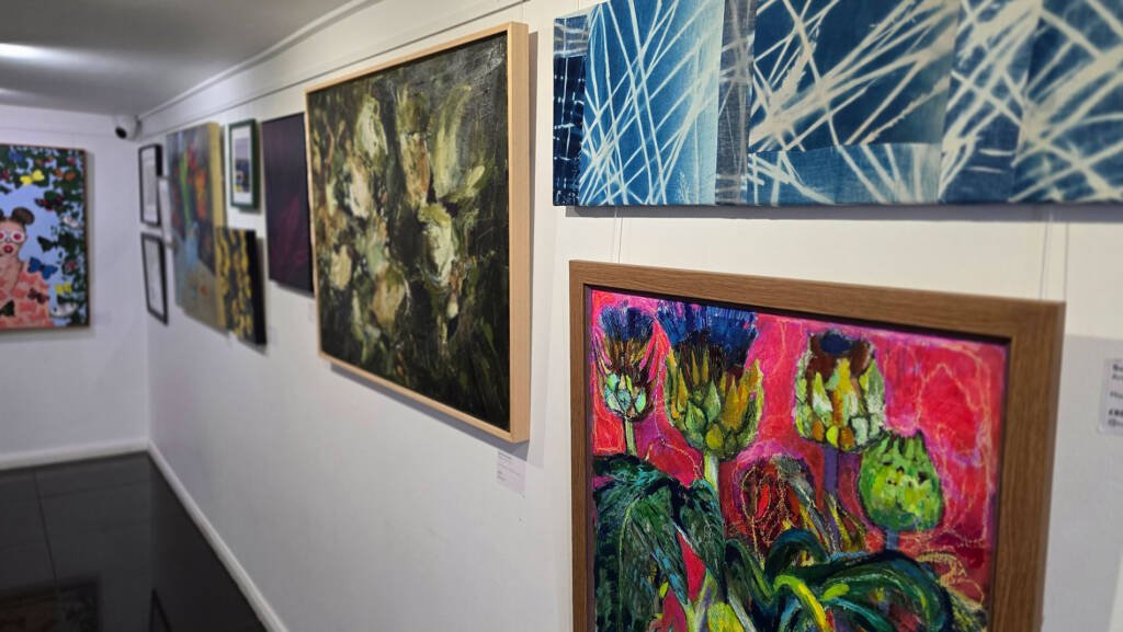 Exhibition hall view featuring “Sanctuary in Motion” by Aliya Bodnar at the Summer Exhibition 2025 in Rochester.