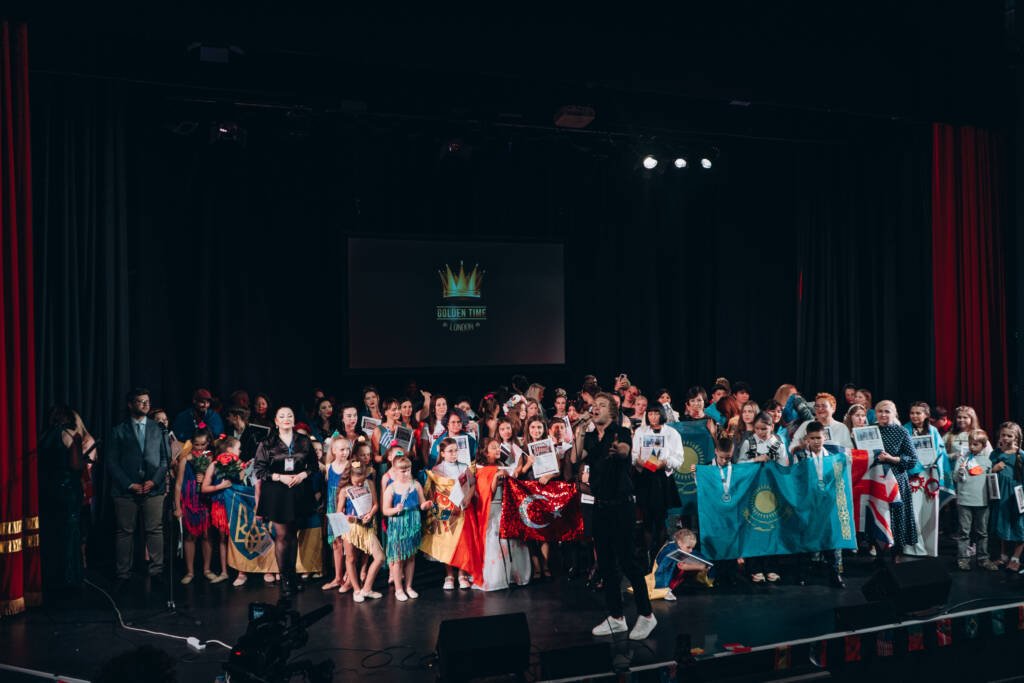 Aliya Bodnar on stage during the final ceremony of the World Talent Award 2024, surrounded by fellow international artists.