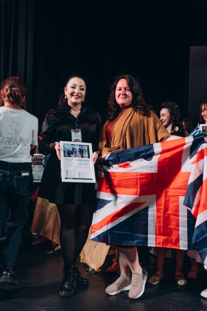 Aliya Bodnar on stage receiving the World Talent Award 2024 alongside other winners.