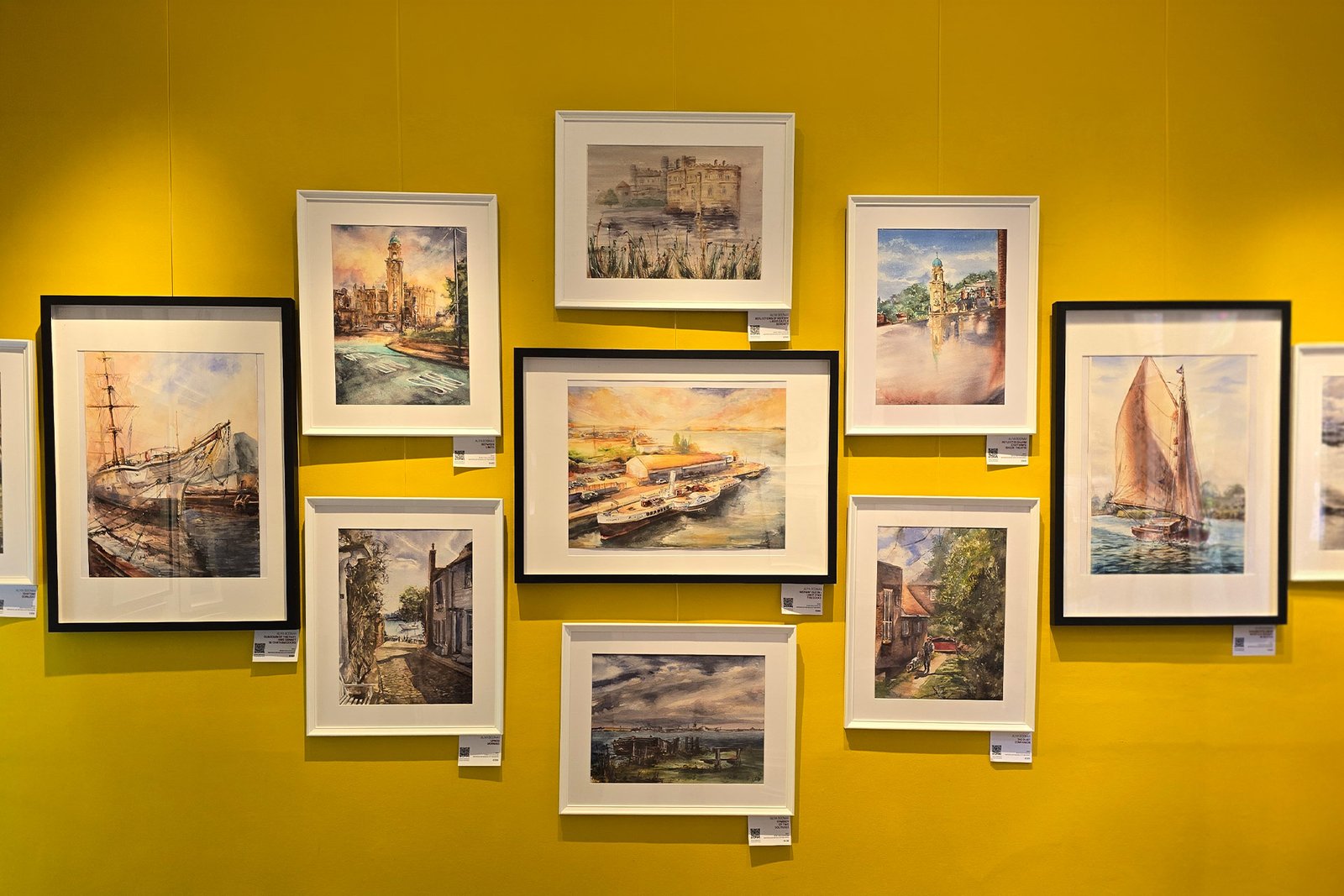 Aliya Bodnar beside artworks at her first solo watercolour exhibition in Kent, exploring visibility, liminal experience and contemporary watercolour practice.